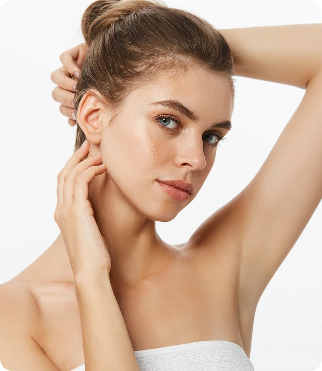 Woman touching her face and neck, demonstrating facial contours