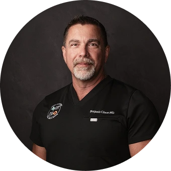 Man in black medical polo shirt with Butterfly Medspa logo