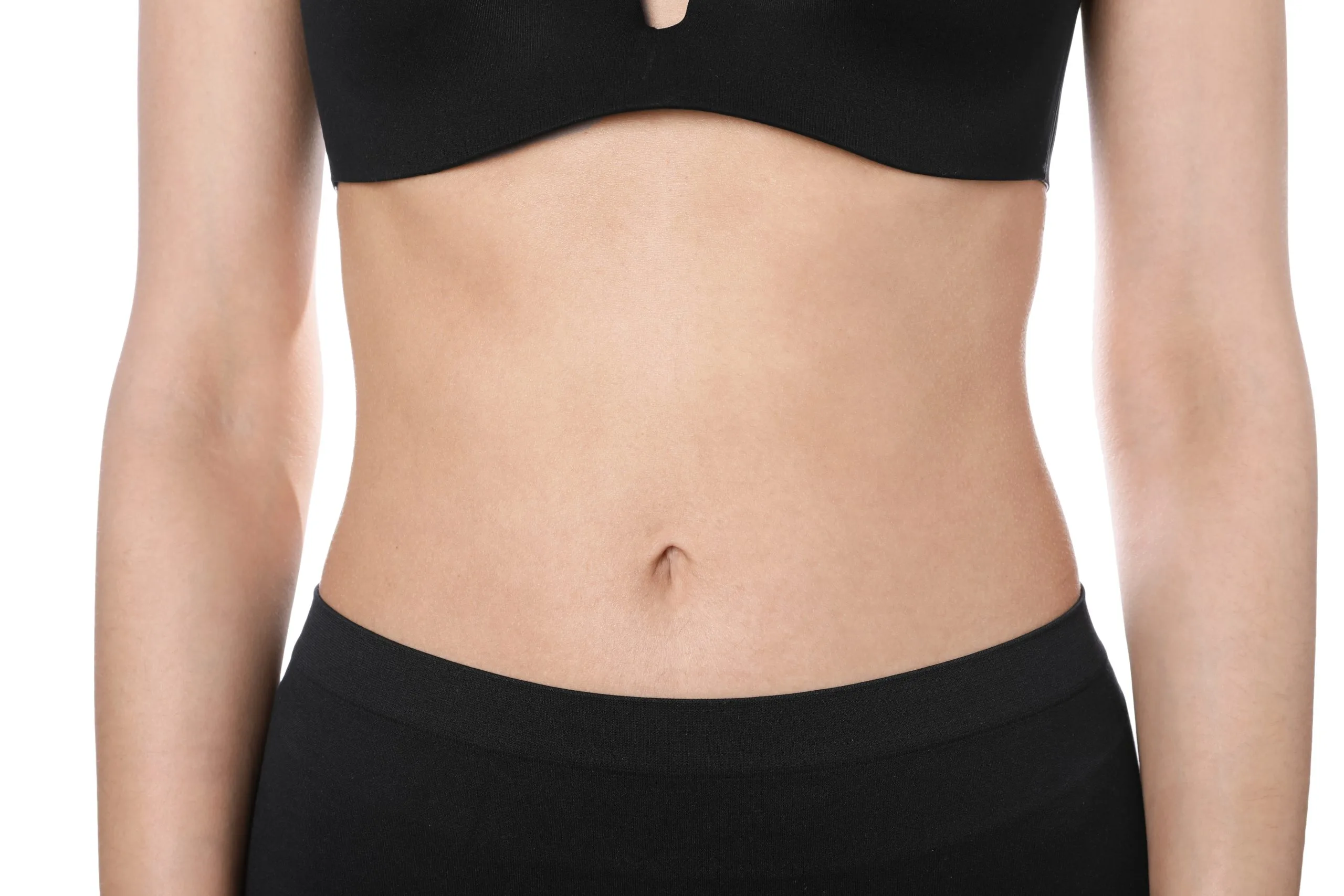 Woman's torso showing toned midsection and flat abdomen